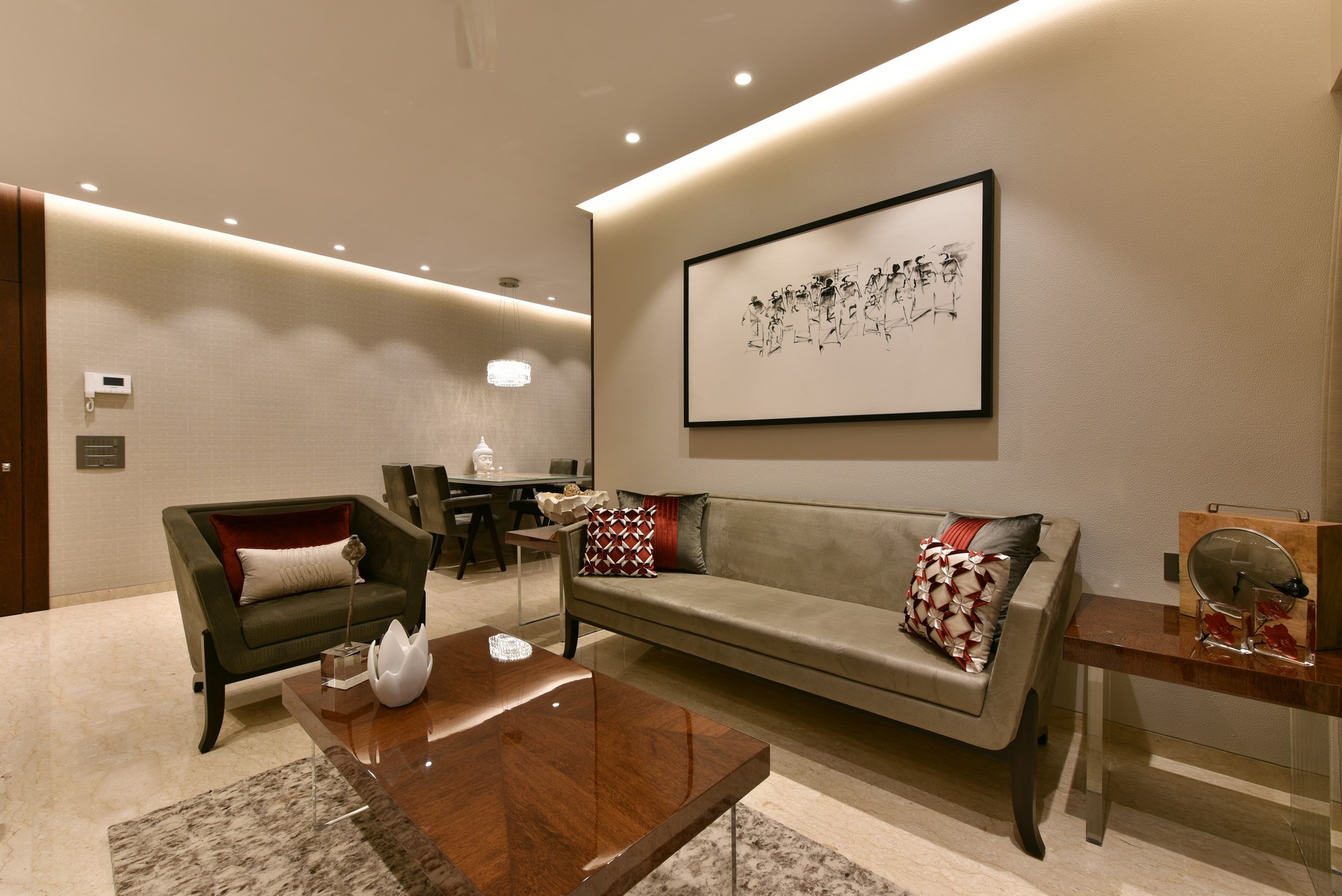 Living room with a large framed artwork above the sofa, showing how artwork can belong naturally to a settled room.